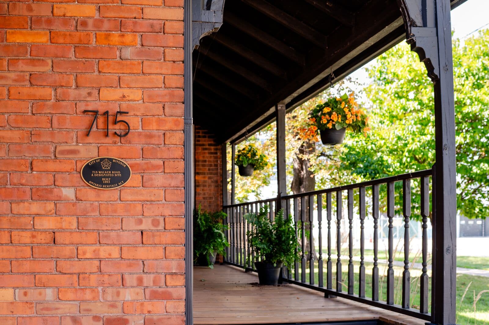Ontario Heritage Act plaque on the brick wall at 715 Walker Rd, a designated site built in 1893